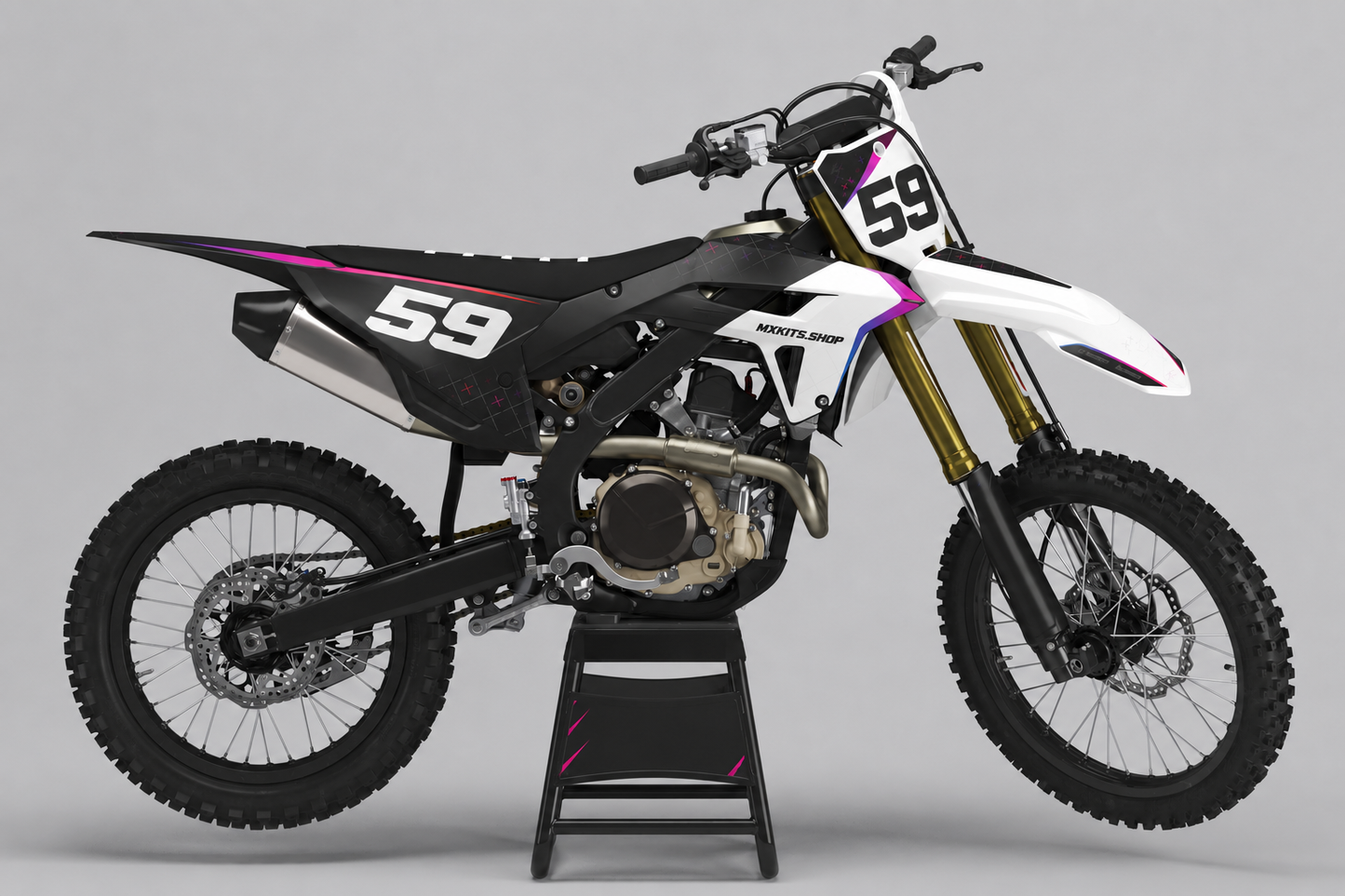 Black white and red Honda motocross graphics kit with custom race number on a studio bike
