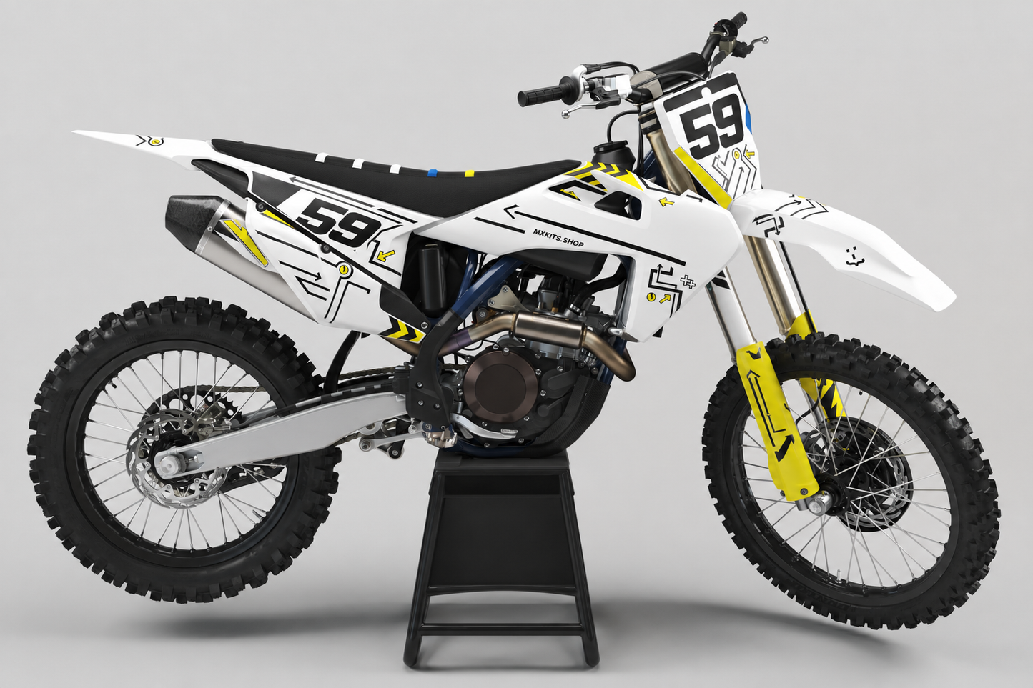 White black and yellow Husqvarna MX graphics kit with number 59 on a plain black bike stand