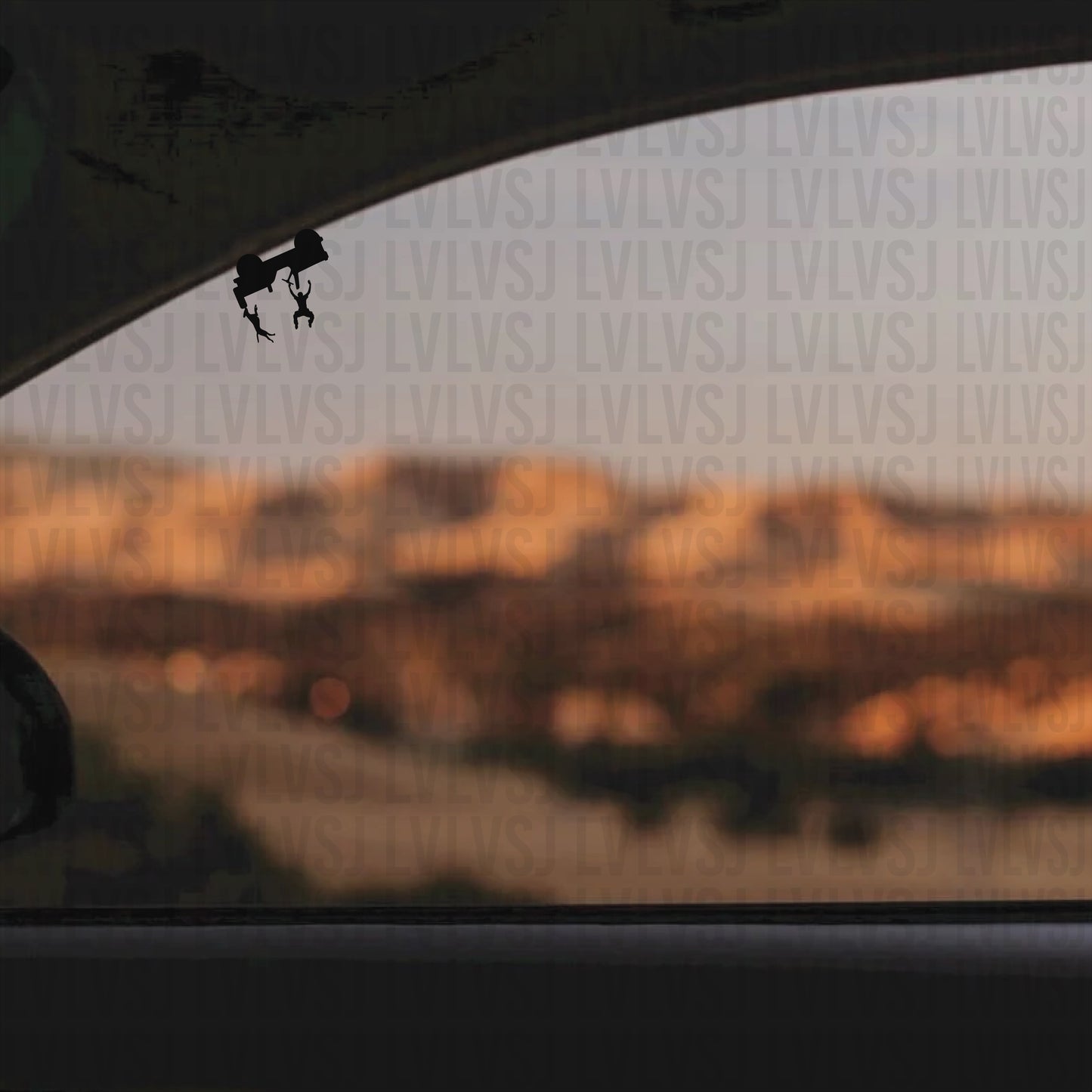 “Funny rollover car window decal – upside-down car with falling driver and dog – black/white die-cut vinyl.