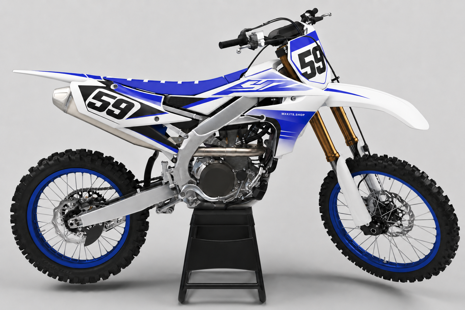 White and cobalt blue Yamaha custom decal set on a studio dirt bike with number 59 and discreet MXKITS.SHOP branding