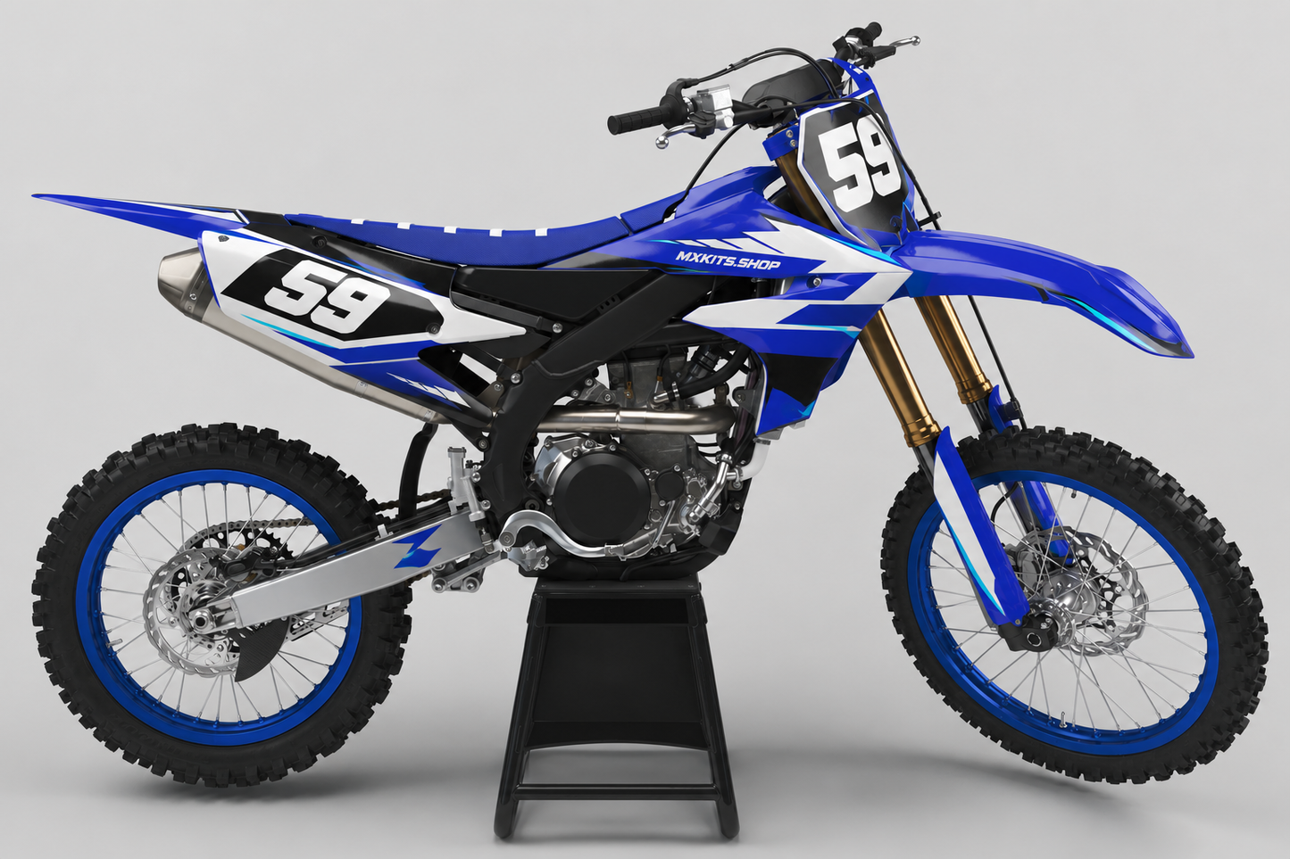 Blue and white Yamaha motocross graphics set displayed on a studio bike with race number 59