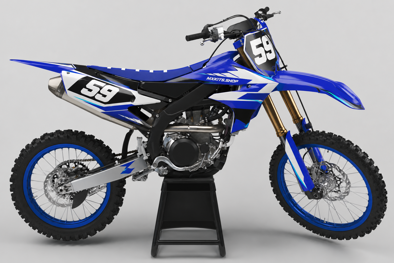 Blue and white Yamaha motocross graphics set displayed on a studio bike with race number 59