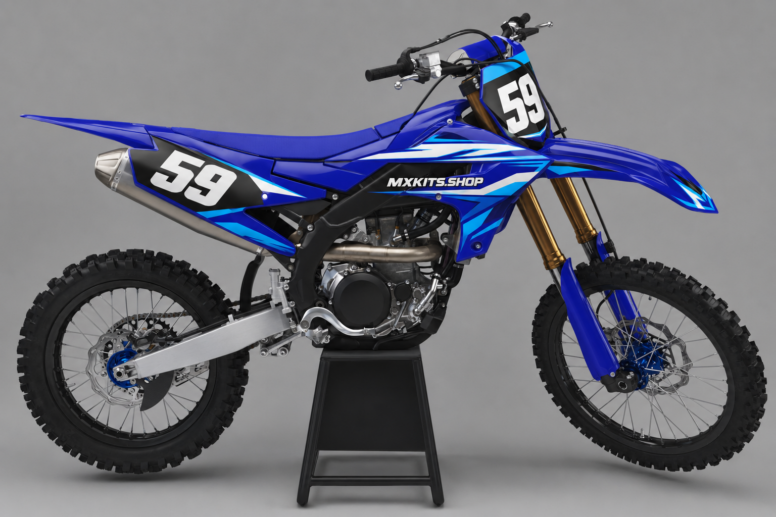 Sponsor-free royal blue white cyan and black Yamaha motocross bike with Blue Momentum graphics, MXKITS.SHOP branding and race number 59