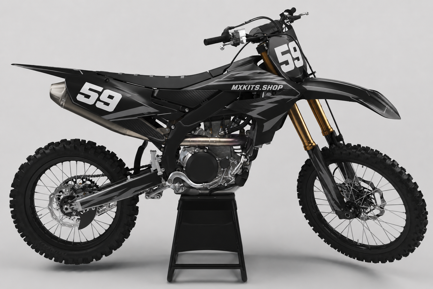 Stealth black and graphite Yamaha motocross graphics kit with subtle carbon texture and number 59