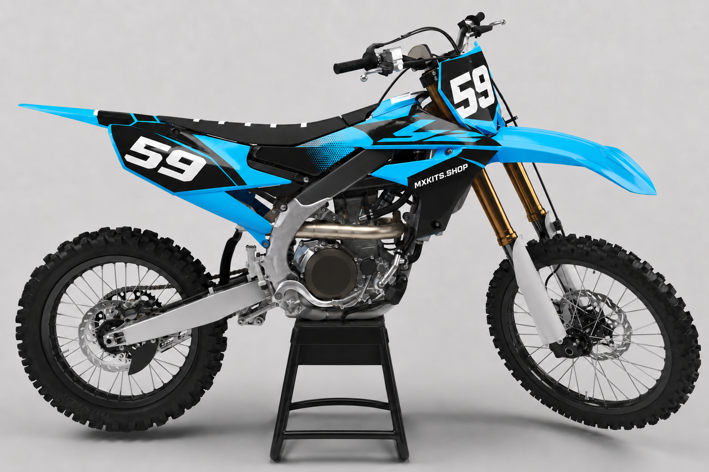 Sponsor-free cyan black and white Yamaha motocross bike with Cyan Flux graphics, MXKITS.SHOP branding and race number 59