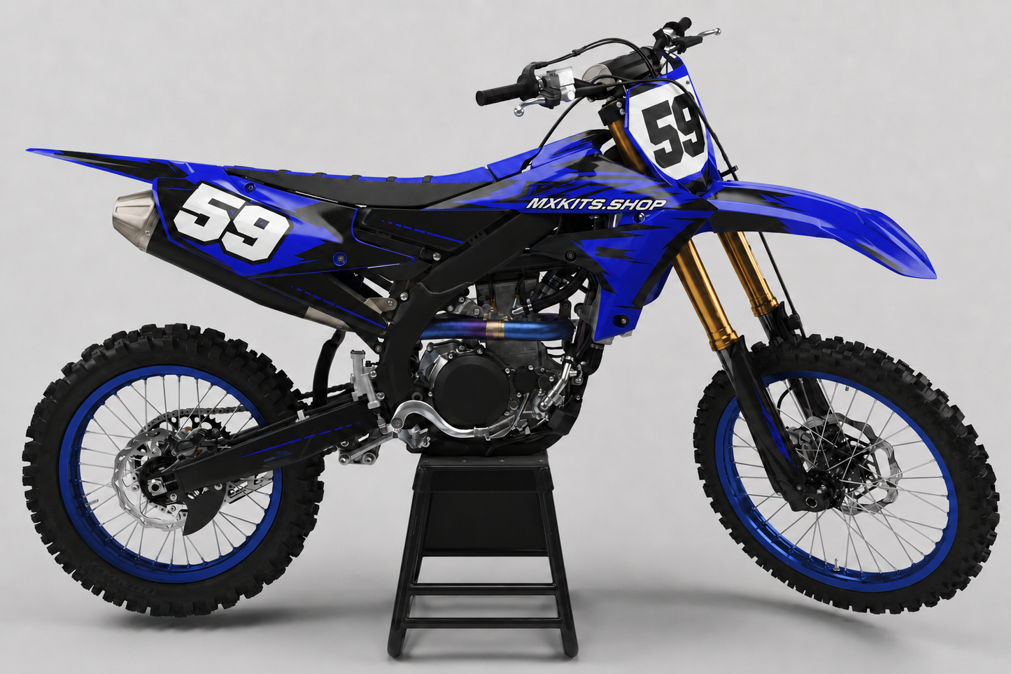 Indigo and black Yamaha motocross bike with sharp layered graphics and race number 59
