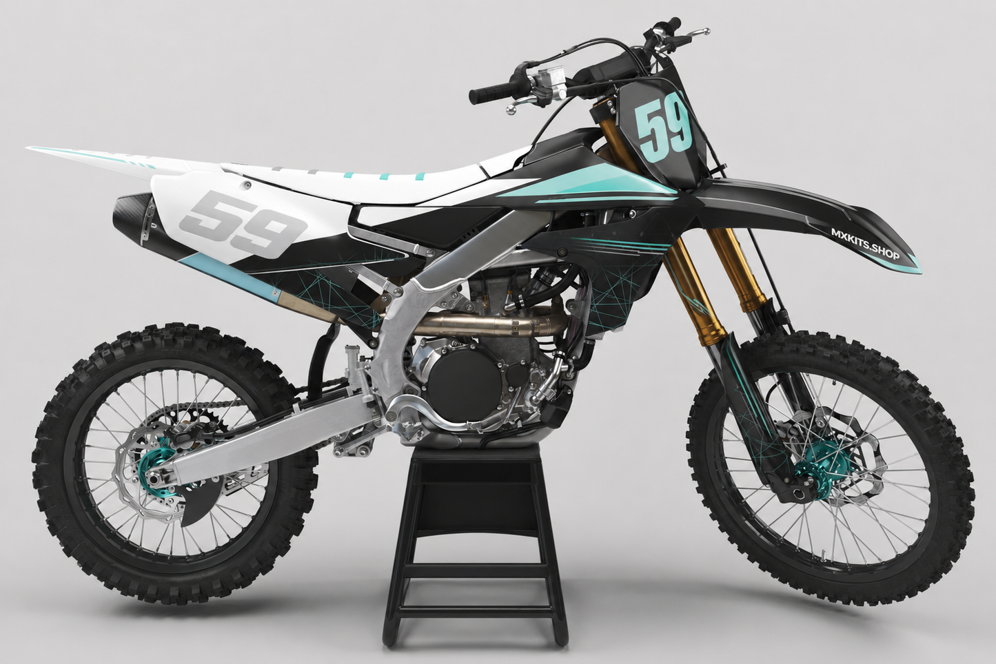 Sponsor-free black and white Yamaha motocross bike with pale teal fracture graphics, MXKITS.SHOP branding and race number 59