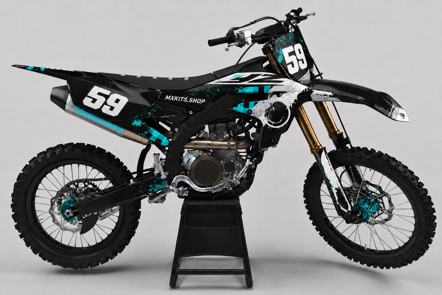 Black Yamaha motocross bike with teal grunge graphics, teal hubs and race number 59
