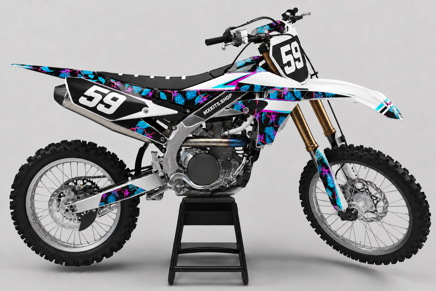 White Yamaha motocross bike with cyan and magenta tropical graphics and race number 59
